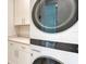 Modern laundry room with stacked washer and dryer at 2492 S Milmar Dr, Sarasota, FL 34237