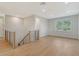 Spacious loft area with hardwood floors and large window at 2492 S Milmar Dr, Sarasota, FL 34237