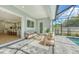 Enjoy the view from the covered patio that looks out onto the pool at 2492 S Milmar Dr, Sarasota, FL 34237