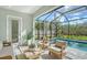 Enjoy the sunshine in this relaxing patio area next to the pool at 2492 S Milmar Dr, Sarasota, FL 34237