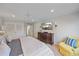 Main bedroom with king-size bed, dresser, and seating area at 100 Sands Point Rd # 223, Longboat Key, FL 34228