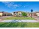 Front view of a charming two-story building with attached garages and well-manicured landscaping at 12413 Osorio Ct # 101, Sarasota, FL 34238