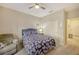 Comfortable bedroom with a queen-size bed and double door closet at 13604 Messina Loop # 103, Lakewood Ranch, FL 34211