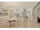 Bright dining area with a round table and chandelier at 13604 Messina Loop # 103, Lakewood Ranch, FL 34211