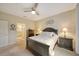 Bright bedroom with a double bed, nightstands, and ceiling fan at 13604 Messina Loop # 103, Lakewood Ranch, FL 34211