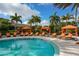 Resort-style pool with cabanas and lounge chairs at 13604 Messina Loop # 103, Lakewood Ranch, FL 34211