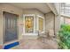 Inviting front entry with small patio and view into the kitchen at 13604 Messina Loop # 103, Lakewood Ranch, FL 34211