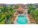 Resort-style pool area with a covered patio and comfortable lounge chairs at 13604 Messina Loop # 103, Lakewood Ranch, FL 34211