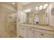 Clean bathroom with double vanity, granite countertop and shower at 13604 Messina Loop # 103, Lakewood Ranch, FL 34211