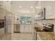 Modern kitchen with granite countertops and stainless steel appliances at 13604 Messina Loop # 103, Lakewood Ranch, FL 34211