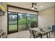 Relaxing screened lanai with table and chairs, overlooking the lush garden at 13604 Messina Loop # 103, Lakewood Ranch, FL 34211
