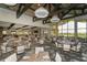 Upscale restaurant with ample seating and large windows overlooking a scenic view at 13604 Messina Loop # 103, Lakewood Ranch, FL 34211
