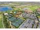 Aerial view of community with clubhouse, pool, tennis courts, and golf course at 13604 Messina Loop # 103, Lakewood Ranch, FL 34211