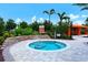 Relaxing hot tub surrounded by lush landscaping at 13604 Messina Loop # 103, Lakewood Ranch, FL 34211