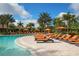 Resort-style pool with cabanas and lounge chairs at 13604 Messina Loop # 103, Lakewood Ranch, FL 34211