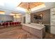 Community room with a kitchen island, wine storage, and herringbone floors at 13604 Messina Loop # 103, Lakewood Ranch, FL 34211