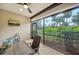 Enjoy the view from this screened lanai, complete with seating and a TV at 13604 Messina Loop # 103, Lakewood Ranch, FL 34211