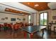 Community game room with ping pong table and seating area at 13604 Messina Loop # 103, Lakewood Ranch, FL 34211