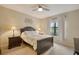 Spacious bedroom with a dark wood bed frame and plenty of natural light at 13604 Messina Loop # 103, Lakewood Ranch, FL 34211