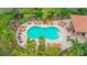 Inviting kidney-shaped pool with plenty of lounge chairs at 13604 Messina Loop # 103, Lakewood Ranch, FL 34211