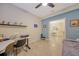 Bright office with desk and view into dining area at 13604 Messina Loop # 103, Lakewood Ranch, FL 34211