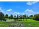 Fenced dog park with a shaded seating area at 13604 Messina Loop # 103, Lakewood Ranch, FL 34211
