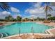 Inviting pool with multiple seating areas and shade structures at 13604 Messina Loop # 103, Lakewood Ranch, FL 34211