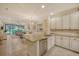Open concept kitchen with granite countertops, stainless steel appliances, and an island at 13604 Messina Loop # 103, Lakewood Ranch, FL 34211