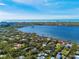 Aerial view of waterfront homes and lush landscape at 1430 Kimlira Ln, Sarasota, FL 34231