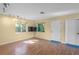 Bright living room with hardwood floors and a view to the backyard at 214 Patterson Ave, Osprey, FL 34229