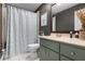 Updated bathroom with a shower/tub combo, vanity, and neutral color palette at 23095 Langdon Ave, Port Charlotte, FL 33954