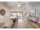 Bright dining room with hardwood floors, a large table, and access to a screened patio at 23095 Langdon Ave, Port Charlotte, FL 33954