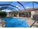Sparkling pool with screened enclosure and patio at 23095 Langdon Ave, Port Charlotte, FL 33954