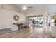 Bright dining room with hardwood floors, a large table, and access to a screened patio at 23095 Langdon Ave, Port Charlotte, FL 33954