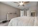 Bright bedroom with dresser, large bed, and wood floors at 23095 Langdon Ave, Port Charlotte, FL 33954