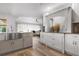 White shaker cabinets and stainless steel appliances in a spacious kitchen at 23095 Langdon Ave, Port Charlotte, FL 33954