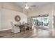 Bright dining room with hardwood floors, a large table, and access to a screened patio at 23095 Langdon Ave, Port Charlotte, FL 33954