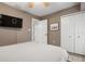 Comfortable bedroom with large TV and ample closet space at 23095 Langdon Ave, Port Charlotte, FL 33954