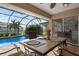 Relaxing view of a covered patio with pool access at 23095 Langdon Ave, Port Charlotte, FL 33954