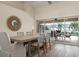 Bright dining room with sliding doors leading to a view of the pool and patio at 23095 Langdon Ave, Port Charlotte, FL 33954
