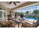 Relaxing screened patio with pool view and dining table at 23095 Langdon Ave, Port Charlotte, FL 33954