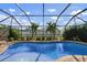 Relaxing screened pool and patio area at 23095 Langdon Ave, Port Charlotte, FL 33954