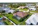 An aerial shot of a home with a pool and fenced-in backyard at 23095 Langdon Ave, Port Charlotte, FL 33954