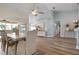Bright dining room with hardwood floors, a large table, and access to a screened patio at 23095 Langdon Ave, Port Charlotte, FL 33954