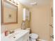 Small bathroom with white vanity and toilet at 2710 51St W Ave, Bradenton, FL 34207