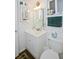 Bathroom with white vanity, toilet and patterned rug at 3516 Lake Bayshore Dr # 109, Bradenton, FL 34205