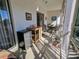 Bright lanai with table, chairs and mini fridge at 3935 Lake Bayshore Dr # F-316, Bradenton, FL 34205