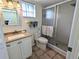 Bright bathroom featuring a shower and updated vanity at 3935 Lake Bayshore Dr # F-316, Bradenton, FL 34205