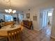 Bright dining area with table and chairs, adjacent to living space at 3935 Lake Bayshore Dr # F-316, Bradenton, FL 34205