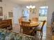 Bright dining room with wood table and kitchen views at 3935 Lake Bayshore Dr # F-316, Bradenton, FL 34205